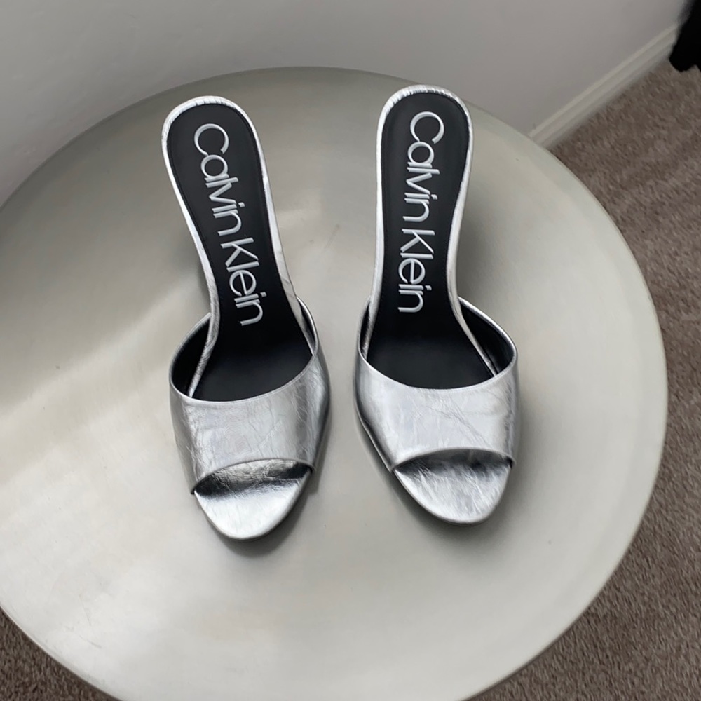 Metallic silver open toe pumps with 3” hills
